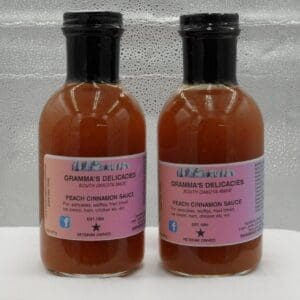 Bottles of Gramma's Delicacies Peach Cinnamon Sauce