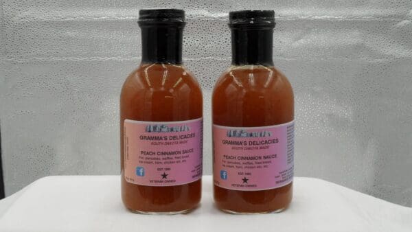 Bottles of Gramma's Delicacies Peach Cinnamon Sauce