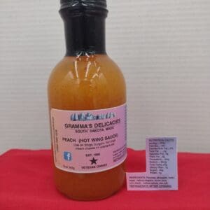 Bottle of Gramma's Delicacies Peach Hot Wing Sauce