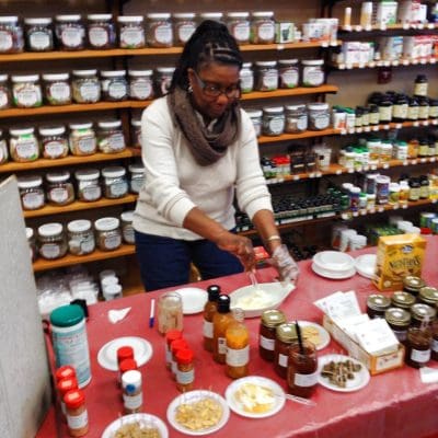 12688069_10154237319716531_6825599420376645533_n Angelique mixing up some food at Gramma's Delicacies stand